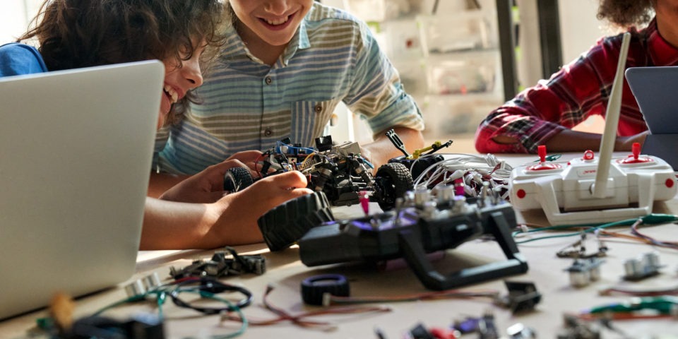 Children build a robotic car in class
