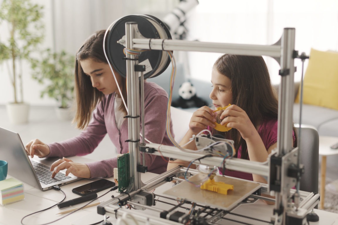 Young girls learning 3D printing at home